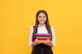 happy teen girl in school uniform hold book stack, reading