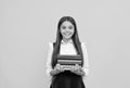 happy teen girl in school uniform hold book stack, reading