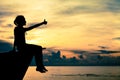 Happy teen girl sitting on beach Royalty Free Stock Photo