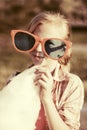 Happy teen girl in sunglasses eating cotton candy outdoor Royalty Free Stock Photo