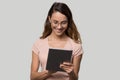 Happy girl using digital tablet surfing online isolated on background Royalty Free Stock Photo