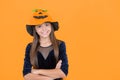 happy teen girl wear pumpkin hat on halloween costume party celebration at autumn traditional holiday of all saints Royalty Free Stock Photo