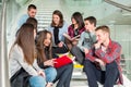 Happy teen girls and boys on the stairs school or college Royalty Free Stock Photo