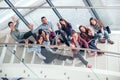 Happy teen girls and boys on the stairs school or college Royalty Free Stock Photo