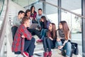 Happy teen girls and boys on the stairs school or college Royalty Free Stock Photo