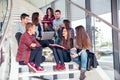 Happy teen girls and boys on the stairs school or college Royalty Free Stock Photo