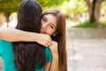 Happy teen hugging her friend