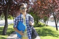 Happy teenage boy caucasian student with backpack going to high school. Outdoor portrait Royalty Free Stock Photo