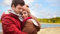 Happy teenage couple hugging over autumn beach Royalty Free Stock Photo