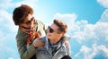 Happy teenage couple in shades having fun outdoors Royalty Free Stock Photo