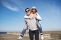 Happy teenage couple in shades having fun outdoors Royalty Free Stock Photo