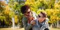 Happy teenage couple in shades having fun outdoors Royalty Free Stock Photo