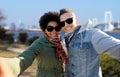 Happy teenage couple taking selfie in tokyo Royalty Free Stock Photo