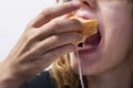 happy teenage girl bites a sandwich cheese Royalty Free Stock Photo