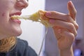 happy teenage girl bites a sandwich cheese Royalty Free Stock Photo