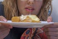 happy teenage girl bites a sandwich with cheese Royalty Free Stock Photo