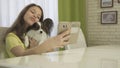 Happy teenage girl doing selfie with her dog Royalty Free Stock Photo