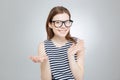 Happy teenage girl in glasses holding copyspace on both palms Royalty Free Stock Photo