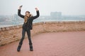 Happy teenage girl listening to the music and dancing