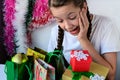 happy teenage girl is looking at her Christmas gifts, Joy, the joys of joy and admiration. Royalty Free Stock Photo