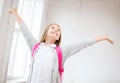 Happy teenage girl with raised hands Royalty Free Stock Photo