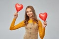 Happy teenage girl with red heart-shaped balloons Royalty Free Stock Photo