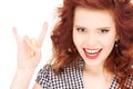 Happy teenage girl showing devil horns gesture Royalty Free Stock Photo