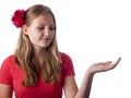 Happy teenage girl showing something on the palm of her hand Royalty Free Stock Photo