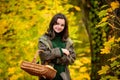 Happy teenage girl smiling. Autumn portrait of a beautiful young girl holds basket. Royalty Free Stock Photo