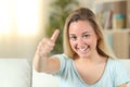 Happy teenage girl with thumbs up at home Royalty Free Stock Photo