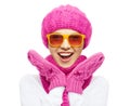 Happy teenage girl in winter hat and sunglasses Royalty Free Stock Photo