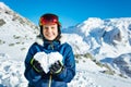 Portrait of cute ski girl with heart snow form Royalty Free Stock Photo