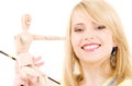 Happy teenage girl with wooden model dummy Royalty Free Stock Photo