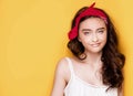 Happy teenage girl on yellow background. Royalty Free Stock Photo