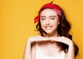 Happy teenage girl on yellow background. Royalty Free Stock Photo