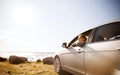 Happy teenage girl or young woman in car Royalty Free Stock Photo