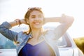 Happy teenage girl or young woman near car Royalty Free Stock Photo