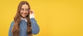 Happy teenage school girl fix eyeglasses smiling yellow background, eyewear. Child face, horizontal poster, teenager Royalty Free Stock Photo