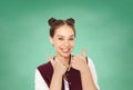 Happy teenage student girl showing thumbs up Royalty Free Stock Photo