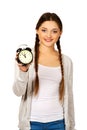 Happy teenage woman with alarmclock. Royalty Free Stock Photo