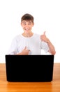 Happy Teenager behind Laptop Royalty Free Stock Photo
