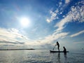 Happy teenager children in swimsuits  having fun on SUP board and  paddling in sea Royalty Free Stock Photo