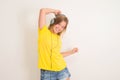 Happy teenager girl in headphones dancing and listening to music Royalty Free Stock Photo