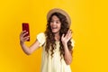 Happy teenager girl 12, 13, 14 years old with smart phone. Hipster teen girl types message on cellphone, enjoys mobile Royalty Free Stock Photo