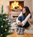 Happy teenager kid near christmas tree Royalty Free Stock Photo