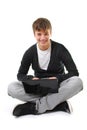 Happy teenager with laptop isolated