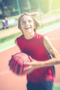 Happy teenager play basketball outdoor healthy sporty teenagers lifestyle concept in spring or summer time Royalty Free Stock Photo