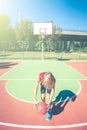 Happy teenager play basketball outdoor healthy sporty teenagers lifestyle concept in spring or summer time Royalty Free Stock Photo