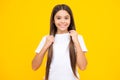 Happy teenager portrait. Smiling girl. Headshot portrait of teenager child girl isolated on studio background. Childhood Royalty Free Stock Photo