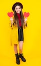 Happy teenager portrait. Young teenager child girl with heart shape. Happy Valentines Day. Love and pleasant feelings Royalty Free Stock Photo